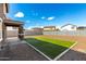 The backyard features low-maintenance desert landscaping and ample space at 20116 W Monroe St, Buckeye, AZ 85326