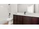 A well-lit bathroom features modern fixtures and sleek design elements at 20116 W Monroe St, Buckeye, AZ 85326