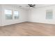 A bright primary bedroom with large windows and a light-colored floor at 20116 W Monroe St, Buckeye, AZ 85326