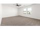 Bright, open bedroom featuring neutral carpet and multiple windows at 20116 W Monroe St, Buckeye, AZ 85326