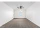 Spacious bedroom with neutral carpet and a ceiling fan at 20116 W Monroe St, Buckeye, AZ 85326
