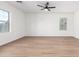 A bright bedroom featuring multiple windows and a light-colored floor at 20116 W Monroe St, Buckeye, AZ 85326