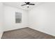 A simple bedroom with neutral carpet and a window with a view at 20116 W Monroe St, Buckeye, AZ 85326