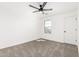 Well-lit bedroom with a ceiling fan and a single window view at 20116 W Monroe St, Buckeye, AZ 85326