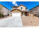 Two-story home featuring a driveway, two-car garage, and low maintenance front yard landscaping at 20116 W Monroe St, Buckeye, AZ 85326