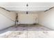 A garage with overhead door, and mechanical components at 20116 W Monroe St, Buckeye, AZ 85326