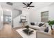 Bright living room with stylish furniture and decor and a view to the stairway at 20116 W Monroe St, Buckeye, AZ 85326