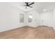 Bright, airy living room with multiple windows and an entryway with a light-colored floor at 20116 W Monroe St, Buckeye, AZ 85326