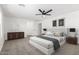 Stylishly staged primary bedroom featuring a plush bed and modern decor at 20116 W Monroe St, Buckeye, AZ 85326