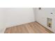 A utility room with hardwood flooring and utility hookups on white walls at 20116 W Monroe St, Buckeye, AZ 85326