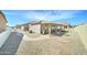 Expansive backyard showcasing a covered patio, seating area, and well-maintained landscaping at 2101 S Meridian Rd # 146, Apache Junction, AZ 85120