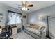 Bedroom with a desk, sleeper sofa, and ceiling fan for comfortable living at 2101 S Meridian Rd # 146, Apache Junction, AZ 85120