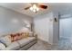 Cozy bedroom featuring a comfortable sofa, closet, and neutral gray walls at 2101 S Meridian Rd # 146, Apache Junction, AZ 85120