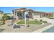 Beautiful single-story home with landscaped front yard, desert plants and small green space at 2101 S Meridian Rd # 146, Apache Junction, AZ 85120