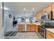 Bright kitchen featuring stainless steel appliances, open layout, and modern finishes with bar seating and pendant lighting at 2101 S Meridian Rd # 146, Apache Junction, AZ 85120