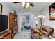 Open living room showcasing a leather sofa, bookcase, and view to the kitchen at 2101 S Meridian Rd # 146, Apache Junction, AZ 85120