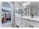 Bathroom showcasing a double vanity with marble countertop and an entrance to closet at 2101 S Meridian Rd # 146, Apache Junction, AZ 85120