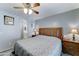 Bedroom showcasing a decorative headboard and ensuite bathroom entrance at 2101 S Meridian Rd # 146, Apache Junction, AZ 85120