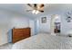 Bedroom with decorative headboard, dresser, and entrance to walk-in closet at 2101 S Meridian Rd # 146, Apache Junction, AZ 85120