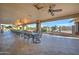 A large outdoor patio with plenty of seating and a covered ceiling creates a nice relaxing shaded common area at 2101 S Meridian Rd # 146, Apache Junction, AZ 85120
