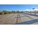 Enjoy shuffleboard on these outdoor courts with benches and a community pool nearby, perfect for fun in the sun at 2101 S Meridian Rd # 146, Apache Junction, AZ 85120