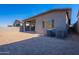Exterior features a covered patio, large windows, and a spacious backyard at 21436 W Meadowbrook Ave, Buckeye, AZ 85396