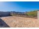 Expansive dirt backyard surrounded by block and metal fencing, offering mountain views and desert landscaping at 21436 W Meadowbrook Ave, Buckeye, AZ 85396