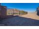 Spacious backyard with block fencing and mountain views in the distance at 21436 W Meadowbrook Ave, Buckeye, AZ 85396