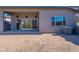 Exterior features a covered patio, large windows, and a spacious backyard at 21436 W Meadowbrook Ave, Buckeye, AZ 85396