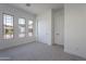 Bedroom featuring neutral walls, carpet, and multiple windows at 21436 W Meadowbrook Ave, Buckeye, AZ 85396