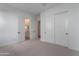 Bedroom with neutral walls, carpet, and closet at 21436 W Meadowbrook Ave, Buckeye, AZ 85396