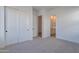 Bedroom with neutral walls, carpet, and closet at 21436 W Meadowbrook Ave, Buckeye, AZ 85396
