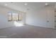 Bright bedroom offers hillside views from a large picture window, plush carpet and neutral finishes at 21436 W Meadowbrook Ave, Buckeye, AZ 85396