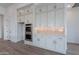 This well-equipped kitchen features built-in ovens, tiled backsplash, and plenty of cabinet storage at 21436 W Meadowbrook Ave, Buckeye, AZ 85396