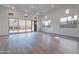 Living room with large windows and sliding doors showcasing mountain views, seamlessly blending indoor and outdoor spaces at 21436 W Meadowbrook Ave, Buckeye, AZ 85396