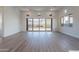 Living room with large sliding glass doors that open to the outdoors offering scenic views of the mountains at 21436 W Meadowbrook Ave, Buckeye, AZ 85396