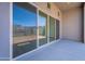 Covered patio with sliding glass doors showcasing mountain views at 21436 W Meadowbrook Ave, Buckeye, AZ 85396