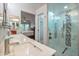 Contemporary bathroom with double sinks, glass shower, and views to the bedroom creates a spa-like experience at 2217 W Claremont St, Phoenix, AZ 85015