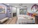 Stylish bedroom with a fireplace, decorative mirror, and slider door to the patio creates a tranquil retreat at 2217 W Claremont St, Phoenix, AZ 85015