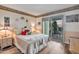 Comfortable bedroom with sliding door to a patio, featuring a quaint decor and warm ambiance at 2217 W Claremont St, Phoenix, AZ 85015