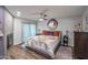 Cozy bedroom featuring a modern fireplace, decorative mirror, and sliding glass door to the outside at 2217 W Claremont St, Phoenix, AZ 85015