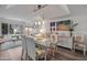 Bright dining room with modern decor and a glass table, perfect for entertaining at 2217 W Claremont St, Phoenix, AZ 85015