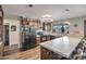 Modern kitchen featuring stainless steel appliances, hardwood floors, and a breakfast bar at 2217 W Claremont St, Phoenix, AZ 85015
