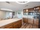 Bright kitchen features light countertops, wood cabinets, and modern lighting, perfect for cooking and entertaining at 2217 W Claremont St, Phoenix, AZ 85015