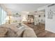 Bright living and dining room with hardwood floors, neutral tones, and ample natural light at 2217 W Claremont St, Phoenix, AZ 85015