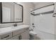 Well-lit bathroom featuring a bathtub and shower combo and single sink vanity with modern fixtures at 23162 E Canary Way, Queen Creek, AZ 85142