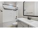 Modern bathroom featuring a sleek vanity, framed mirror, tiled shower with gray trim at 23162 E Canary Way, Queen Creek, AZ 85142