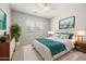 Staged bedroom includes decor, carpet, and furnishings at 23162 E Canary Way, Queen Creek, AZ 85142