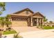 Charming single-story home featuring a two-car garage and well-manicured landscaping at 23162 E Canary Way, Queen Creek, AZ 85142