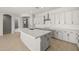 Stylish kitchen featuring a spacious island, stainless steel hood, and ample storage at 23162 E Canary Way, Queen Creek, AZ 85142